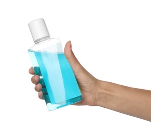 Photo of Woman holding bottle with mouthwash for teeth care on white background