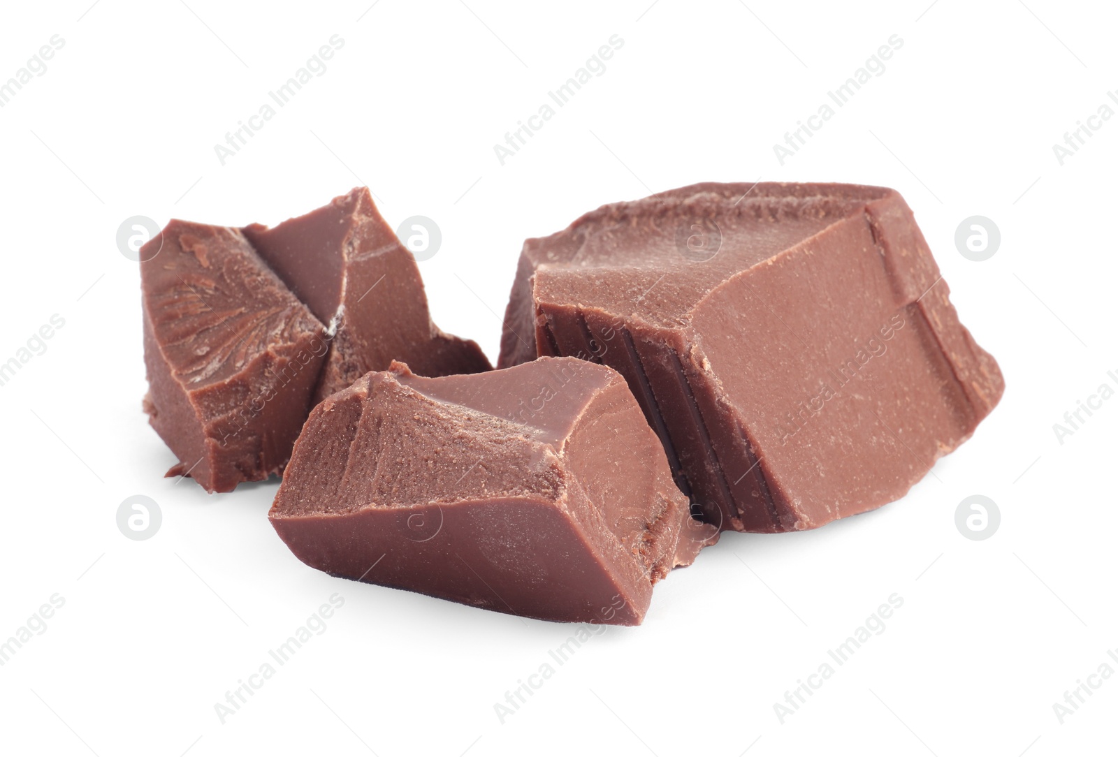 Photo of Pieces of tasty milk chocolate isolated on white