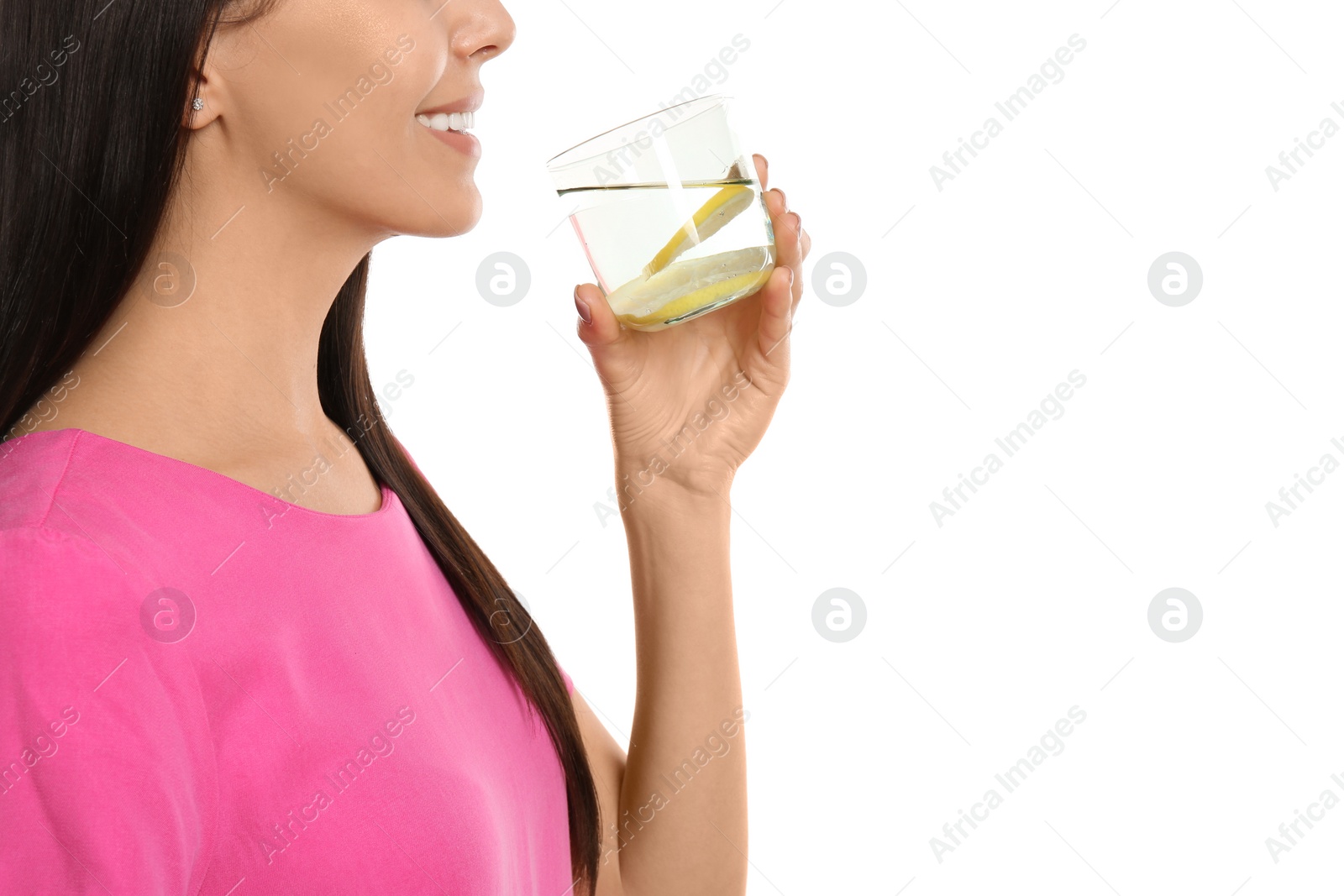 Photo of Young woman with tasty lemon water on white background, closeup