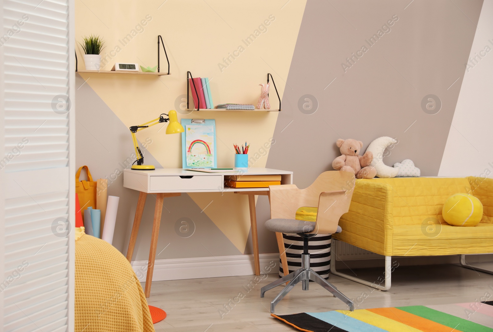 Photo of Stylish child room interior with modern furniture