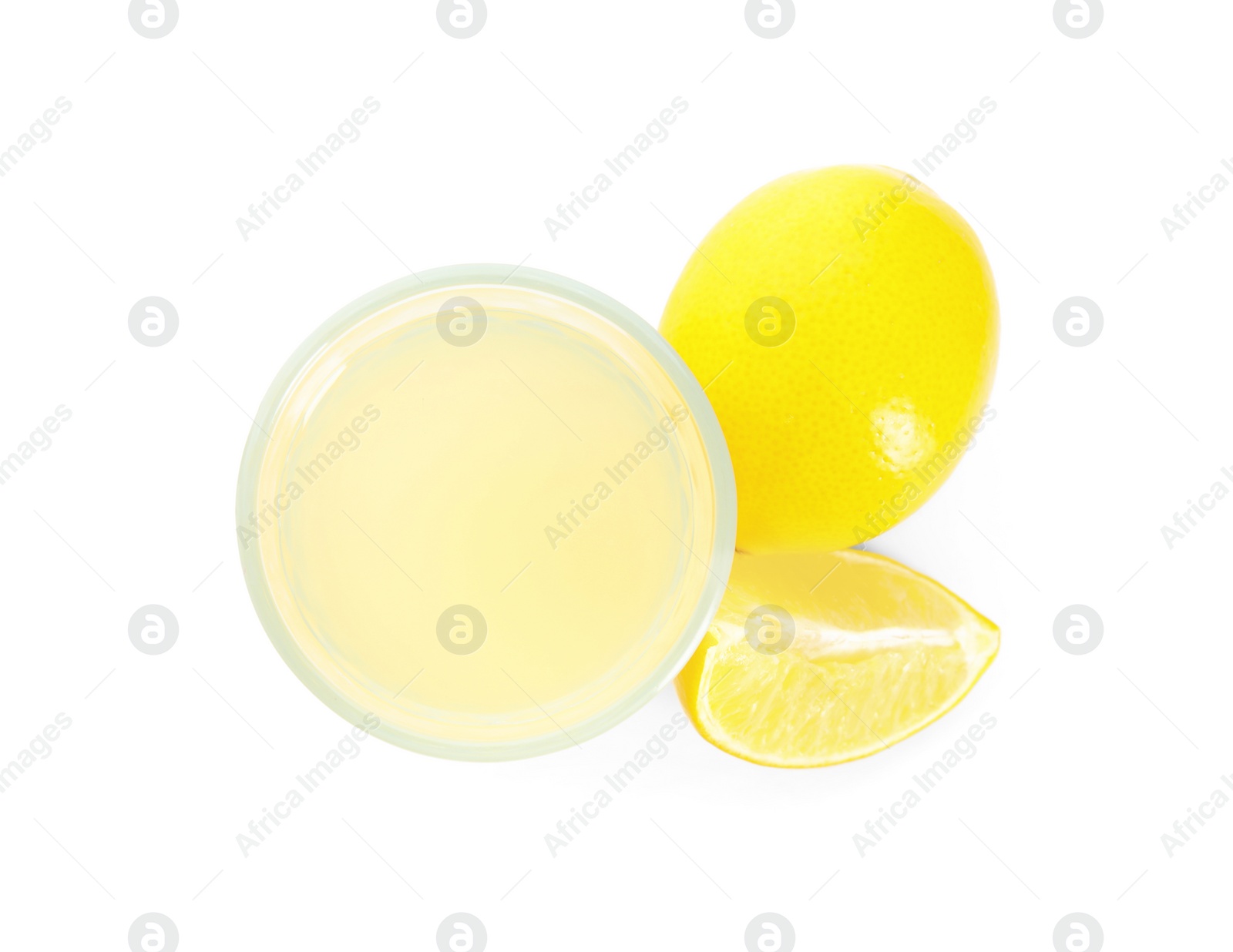 Photo of Freshly squeezed juice and lemons on white background, top view