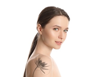 Young woman with beautiful flower tattoo on white background, side view