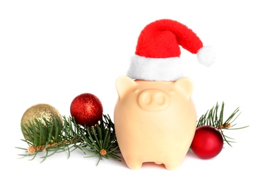 Composition with piggy bank and Christmas decor on white background