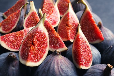 Photo of Fresh ripe fig slices, closeup. Tropical fruit