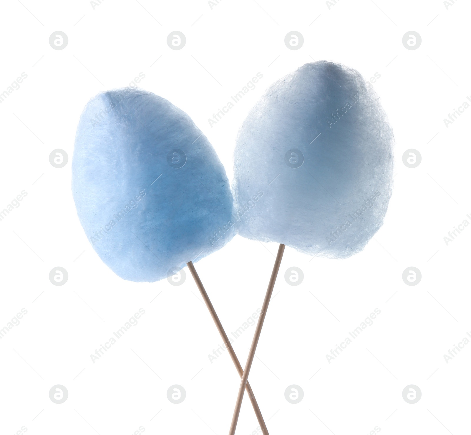 Photo of Sticks with yummy cotton candy isolated on white