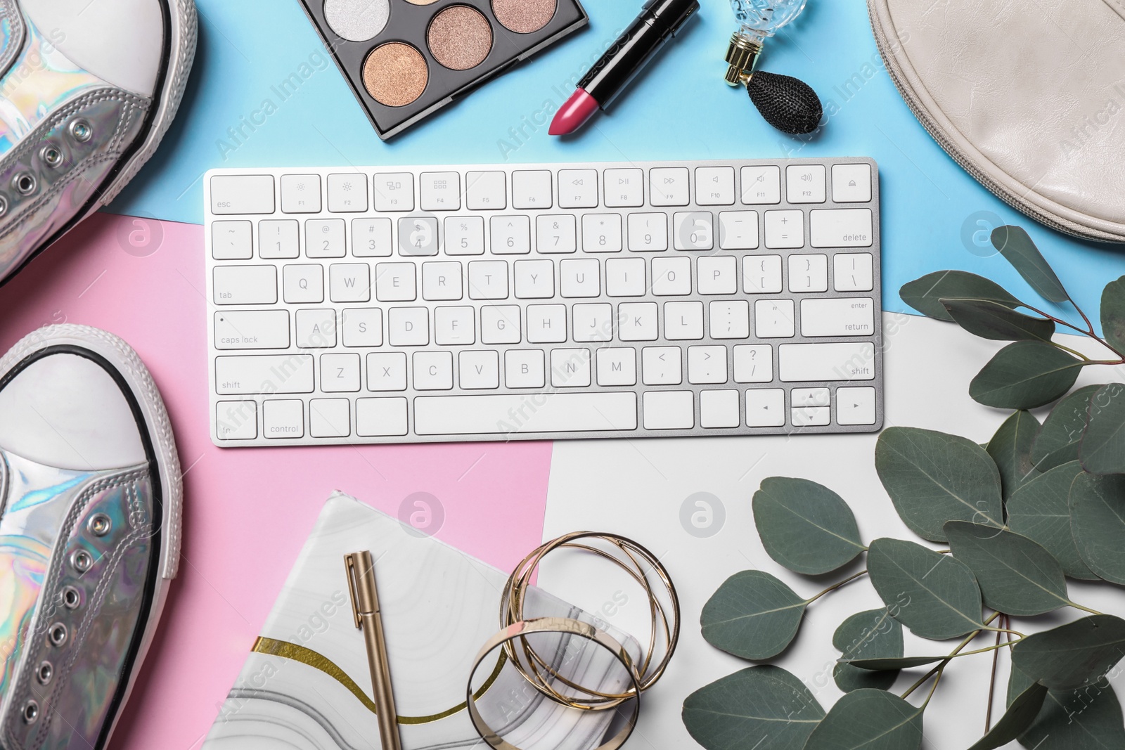 Photo of Flat lay composition with keyboard and blogger's stuff on color background