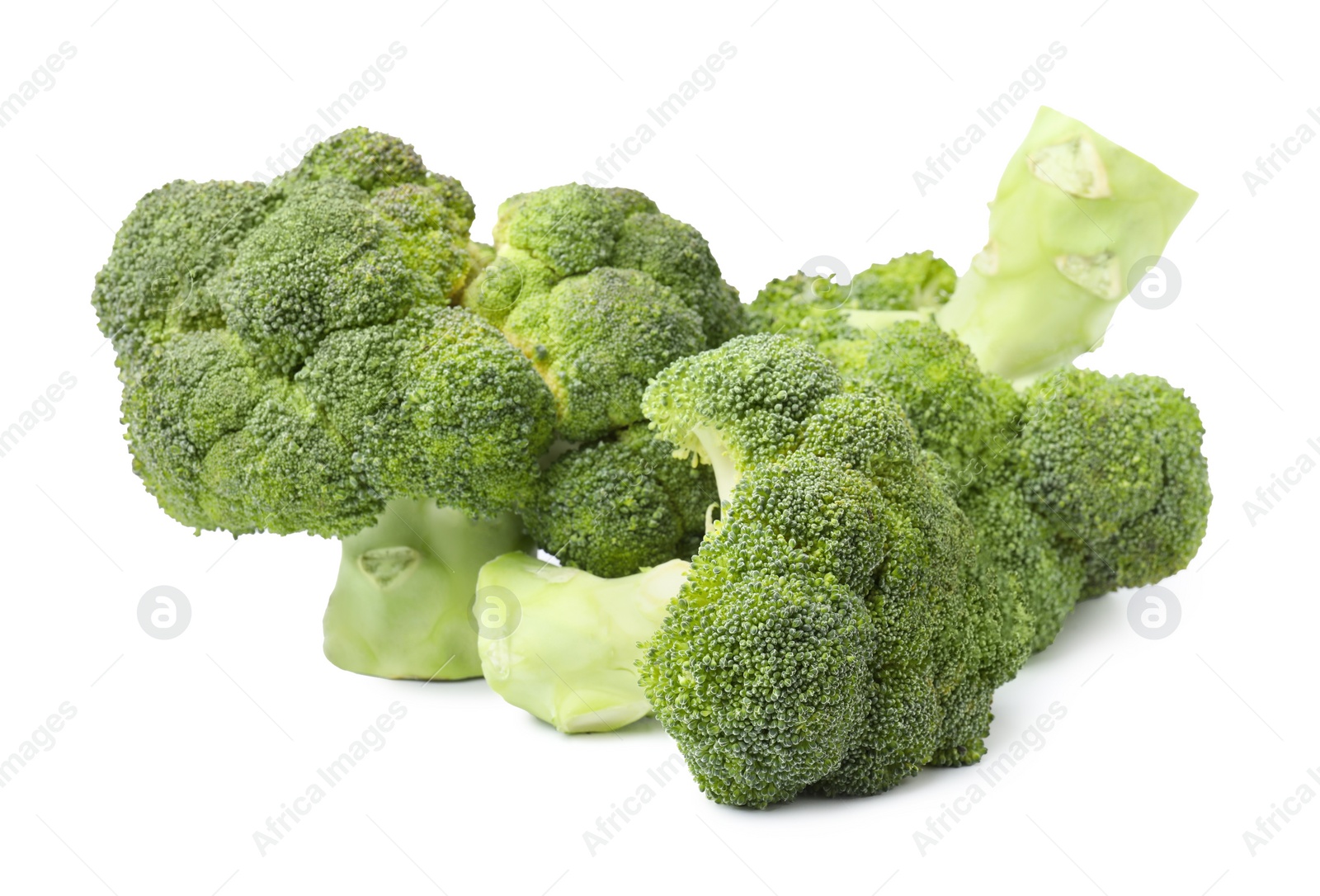 Photo of Pile of fresh raw green broccoli isolated on white