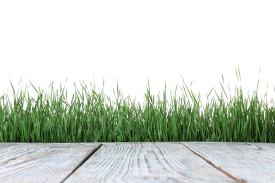 Photo of Wooden deck and green grass isolated on white