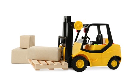 Photo of Toy forklift with wooden pallet and boxes on white background