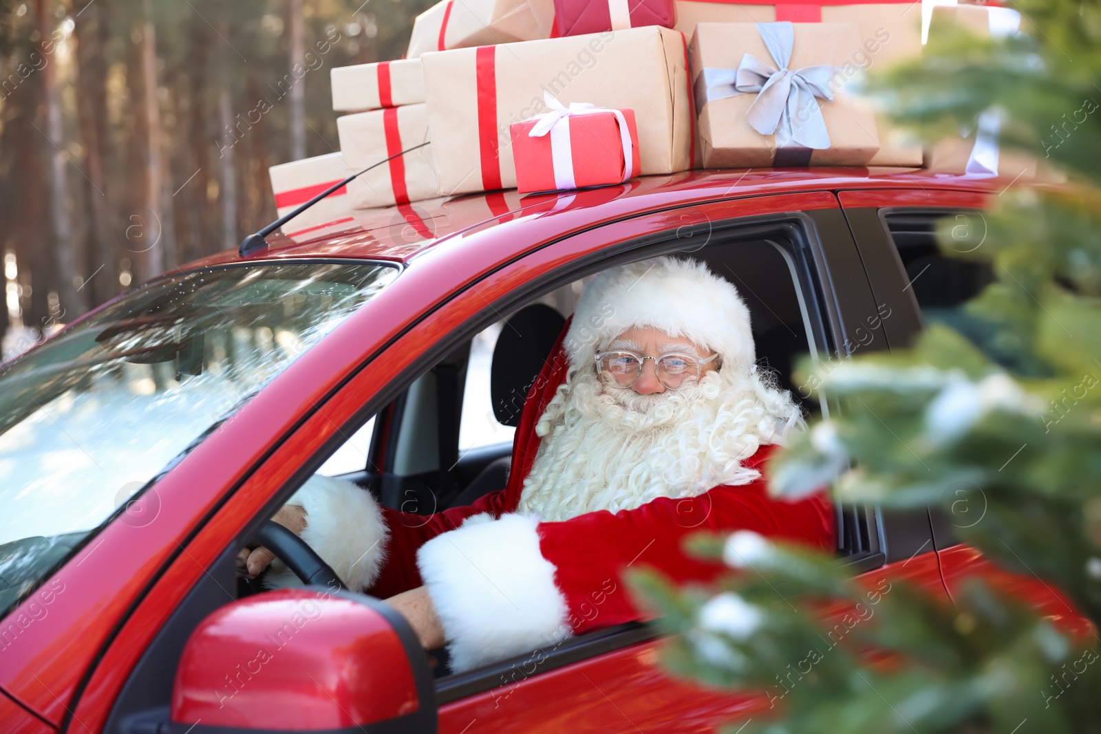 Photo of Authentic Santa Claus in red car, view from outside