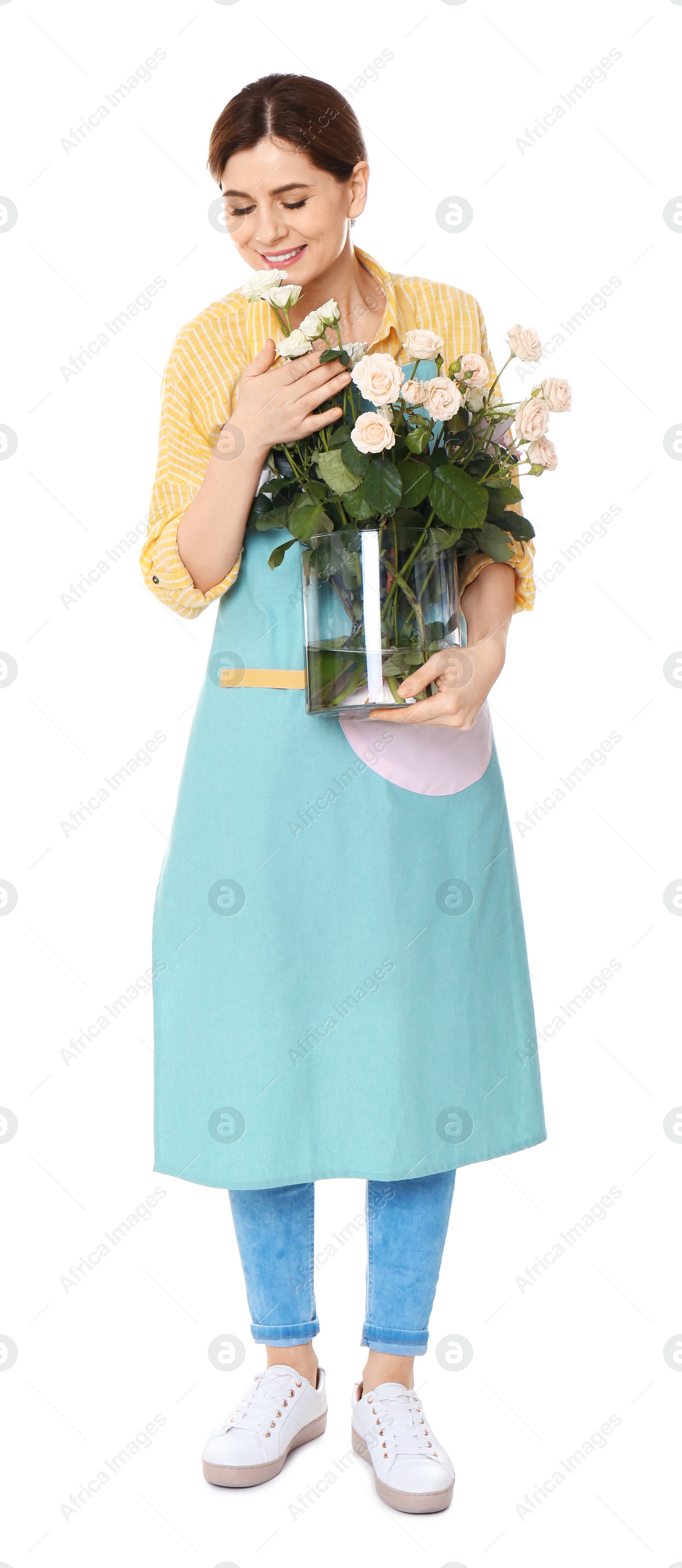 Photo of Female florist holding vase with roses on white background