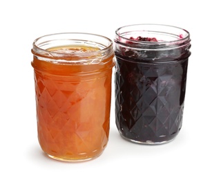 Photo of Two jars with tasty sweet jam on white background