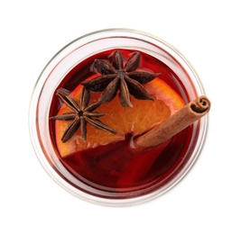 Photo of Glass of mulled wine with spices isolated on white, top view