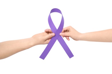 Man and woman holding purple awareness ribbon isolated on white, top view