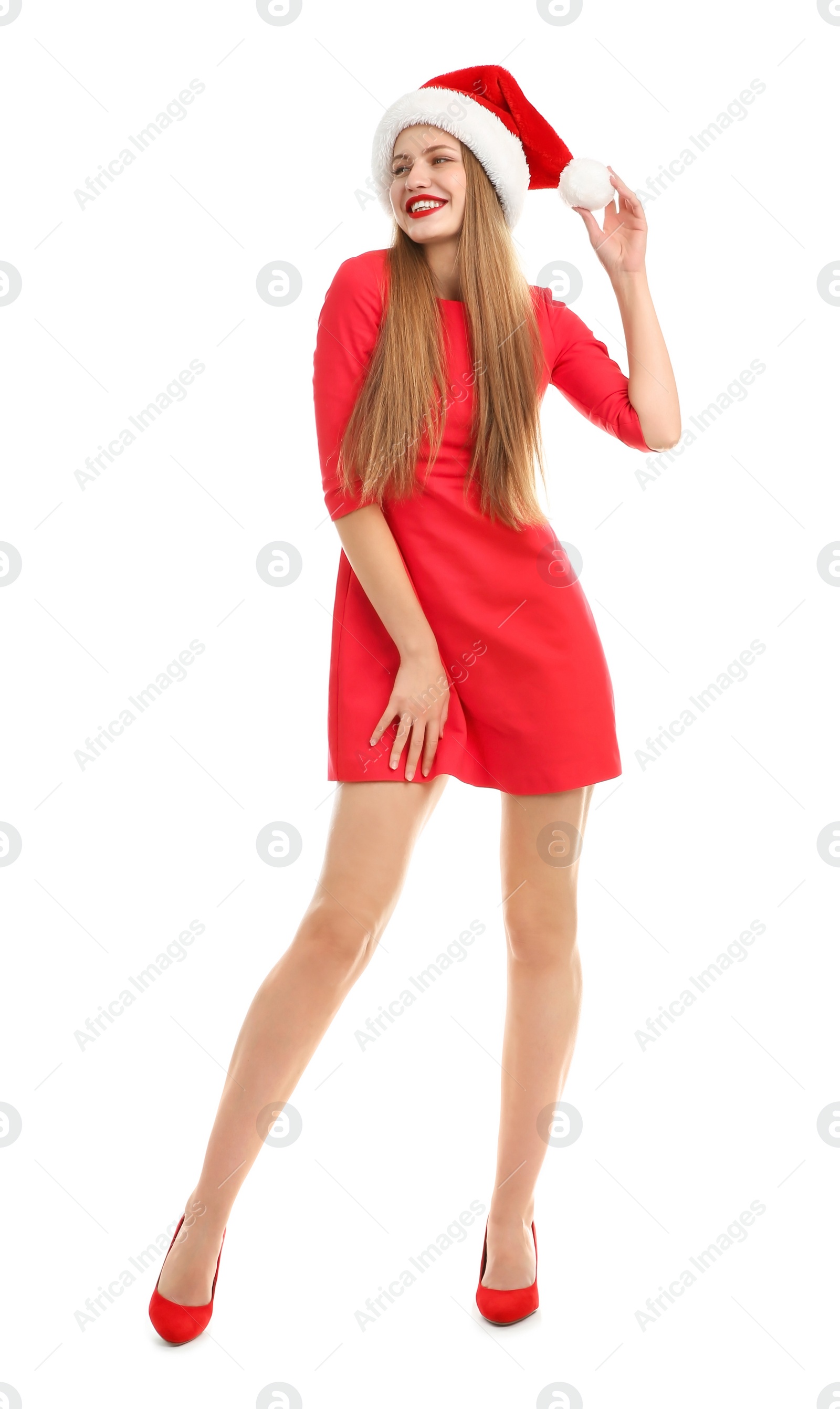 Photo of Young beautiful woman in Santa hat on white background. Christmas celebration