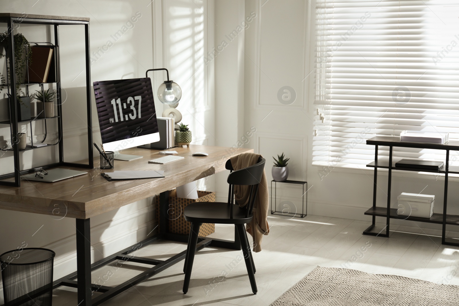 Photo of Room interior with comfortable workplace. Modern computer on wooden desk