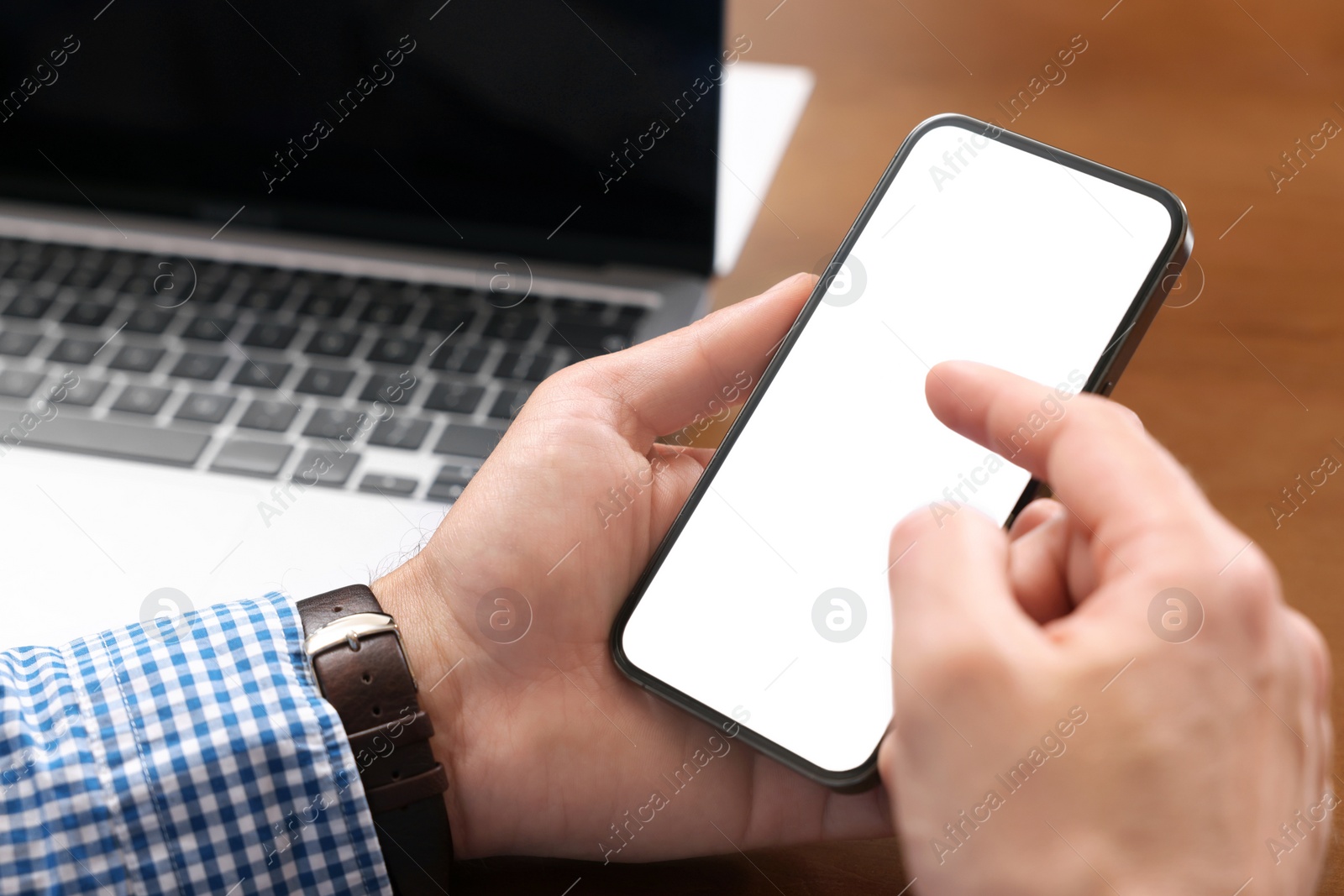 Photo of Man using mobile phone at table, closeup. Space for text