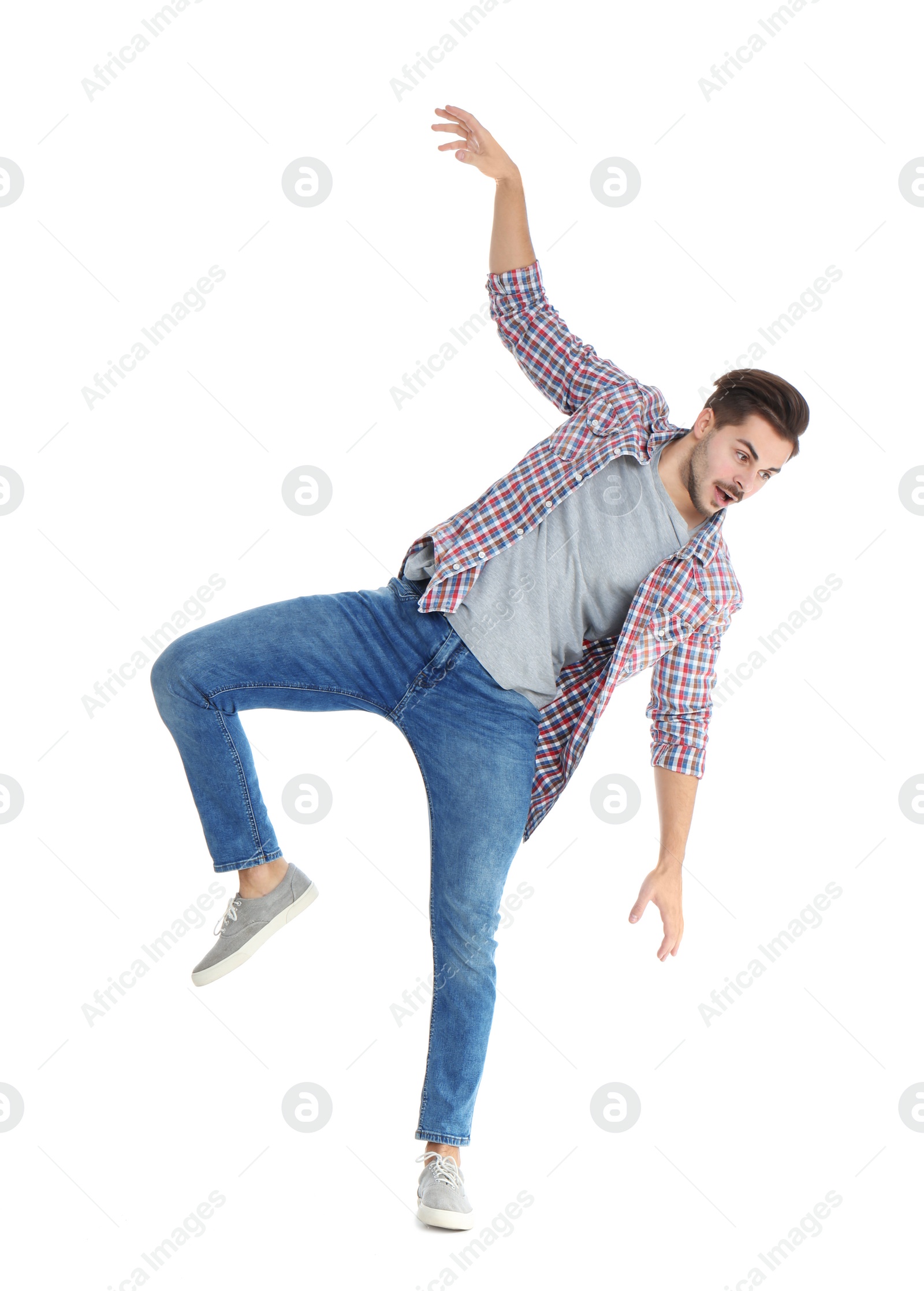 Photo of Young man attracted to magnet on white background