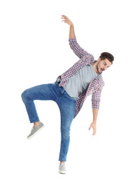 Photo of Young man attracted to magnet on white background