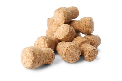 Photo of Heap of sparkling wine corks on white background