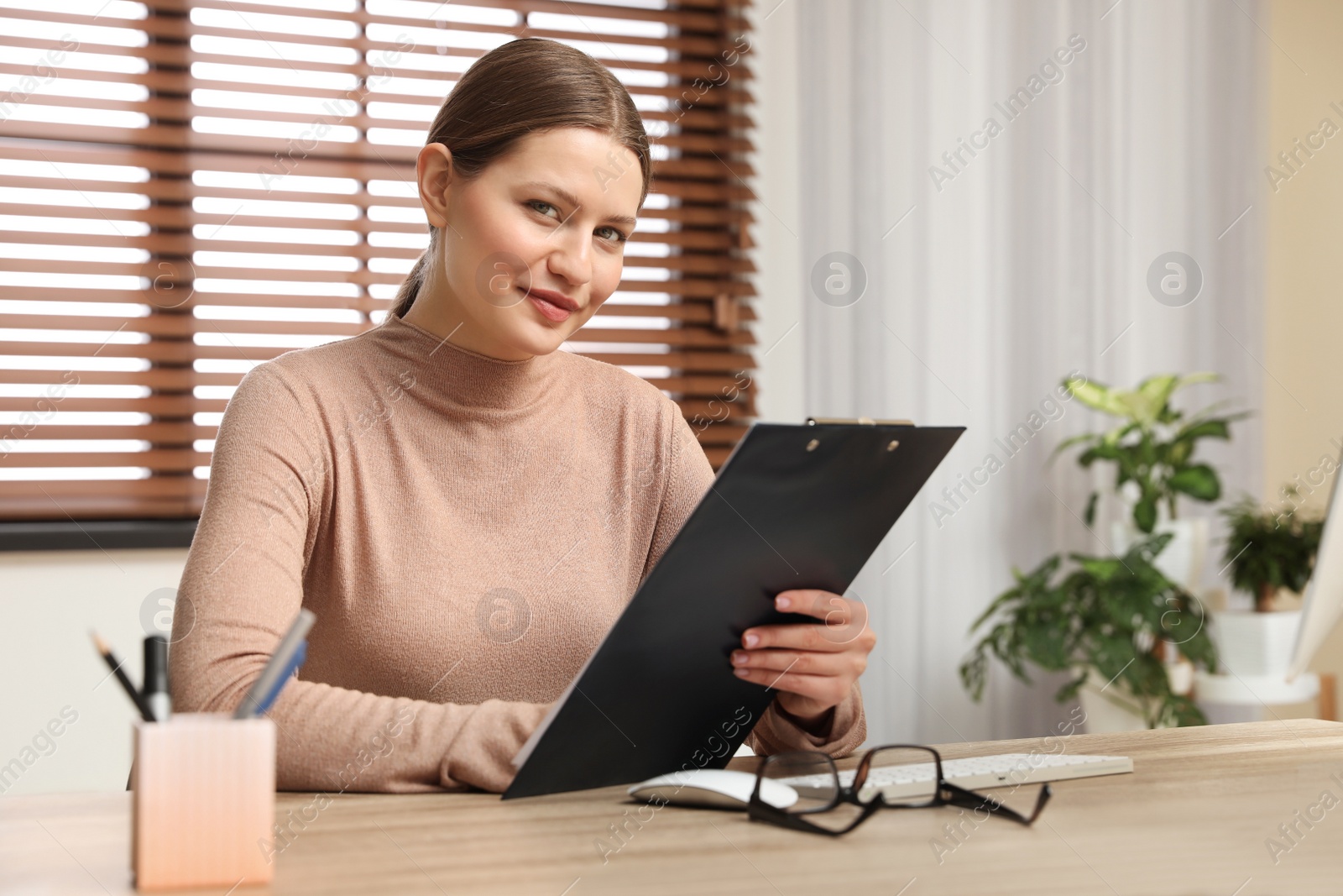 Photo of Professional psychotherapist at table in modern office