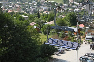 View of cableway seat against mountain village