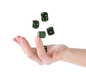 Photo of Woman throwing game dices on white background, closeup