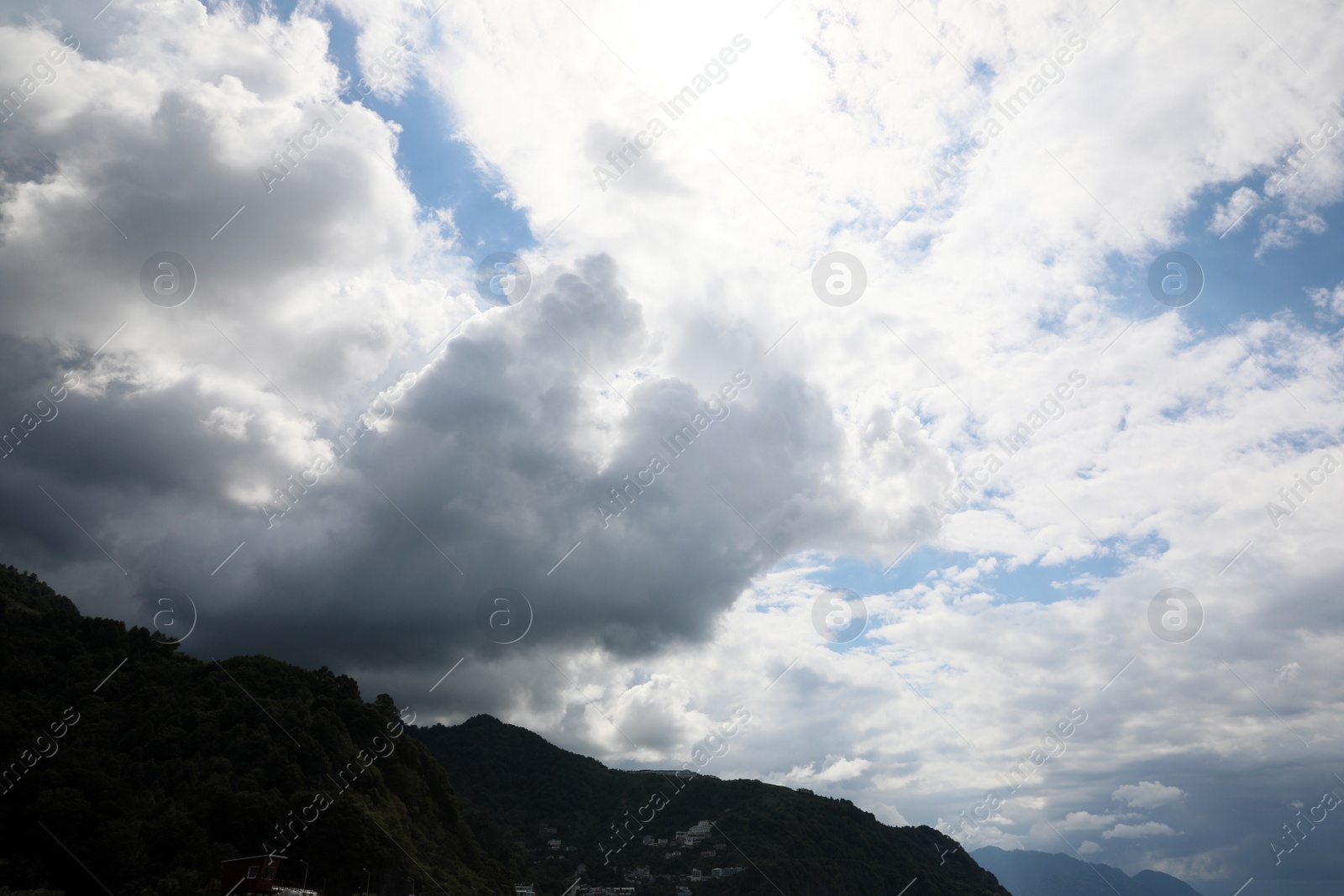 Photo of Picturesque view of mountain under beautiful sky with fluffy clouds