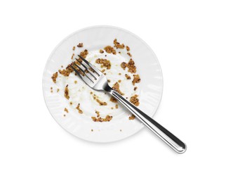 Dirty plate and fork on white background, top view