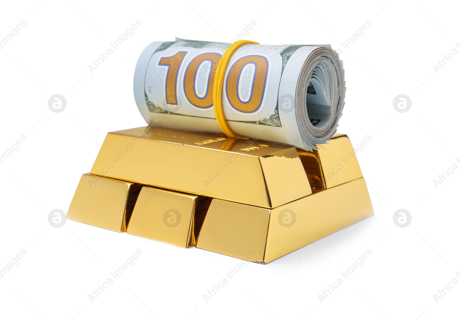 Photo of Shiny gold bars and money on white background