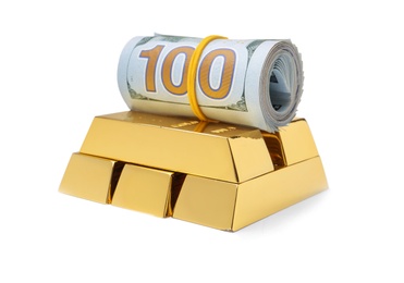 Photo of Shiny gold bars and money on white background