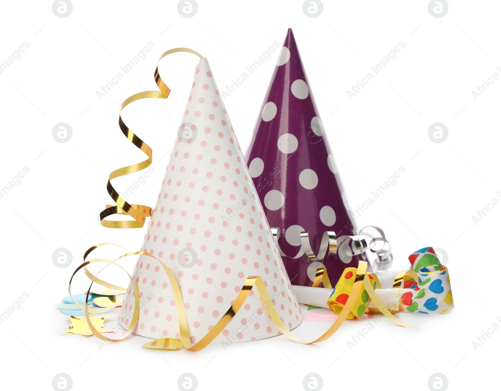 Photo of Party hats, blowers and confetti streamers on white background