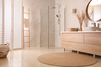 Photo of Modern bathroom interior with stylish white folding screen