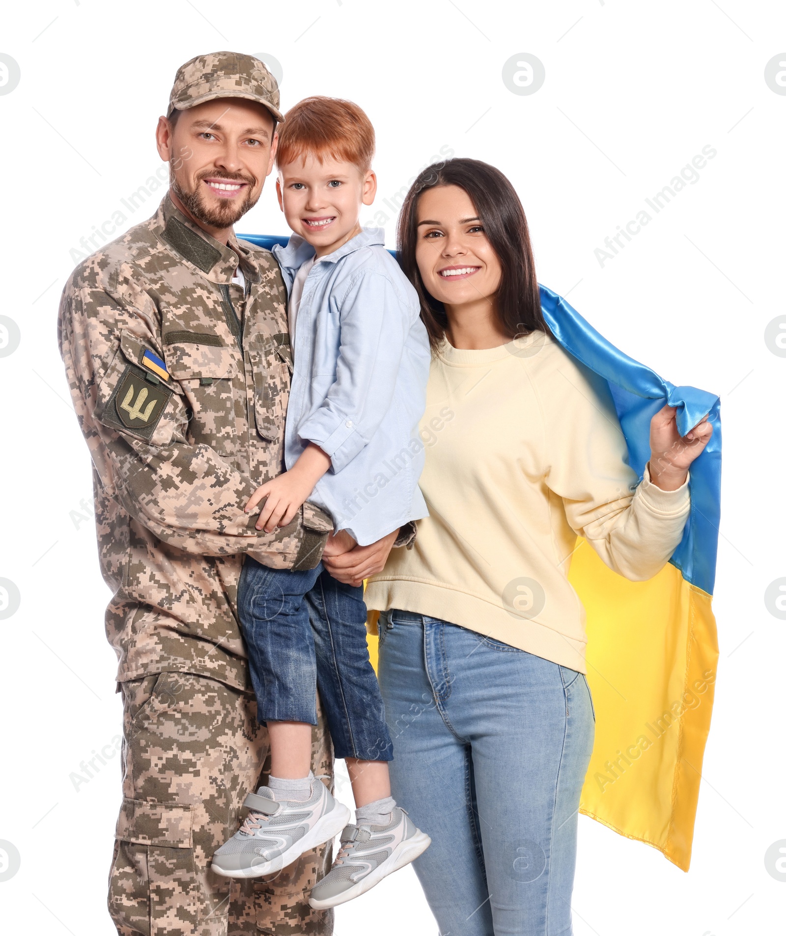 Photo of Ukrainian defender in military uniform and his family with flag on white background