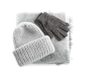 Photo of Woolen gloves, scarf and hat on white background, top view