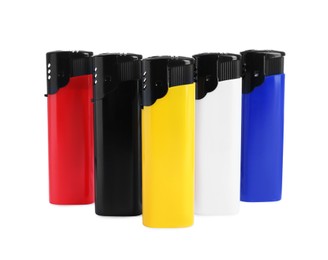 Stylish small pocket lighters on white background