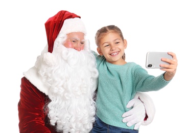 Photo of Little girl taking selfie with authentic Santa Claus on white background