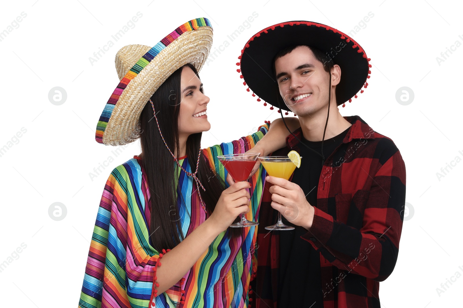 Photo of Lovely couple in Mexican sombrero hats with cocktails on white background