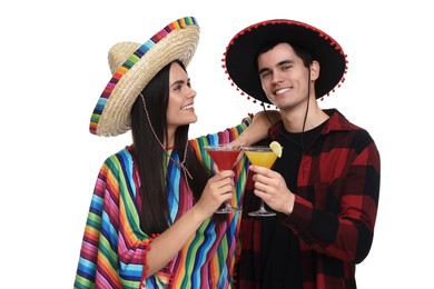 Photo of Lovely couple in Mexican sombrero hats with cocktails on white background