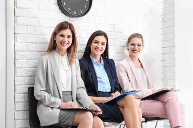 Young women waiting for job interview, indoors