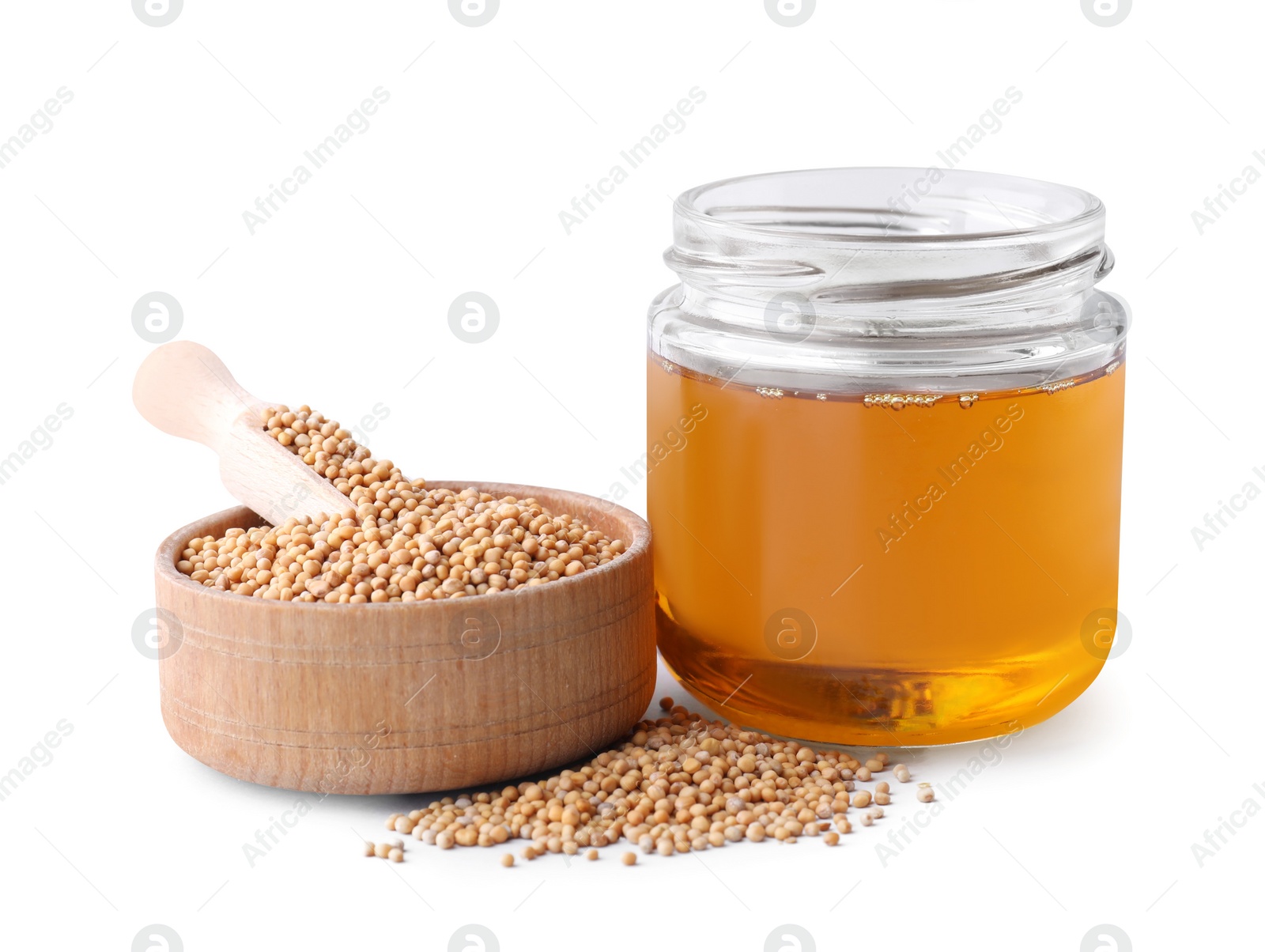 Natural oil and mustard seeds isolated on white Photo of Natural oil and mustard seeds isolated on white