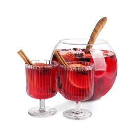 Photo of Glasses and bowl of delicious aromatic punch drink on white background