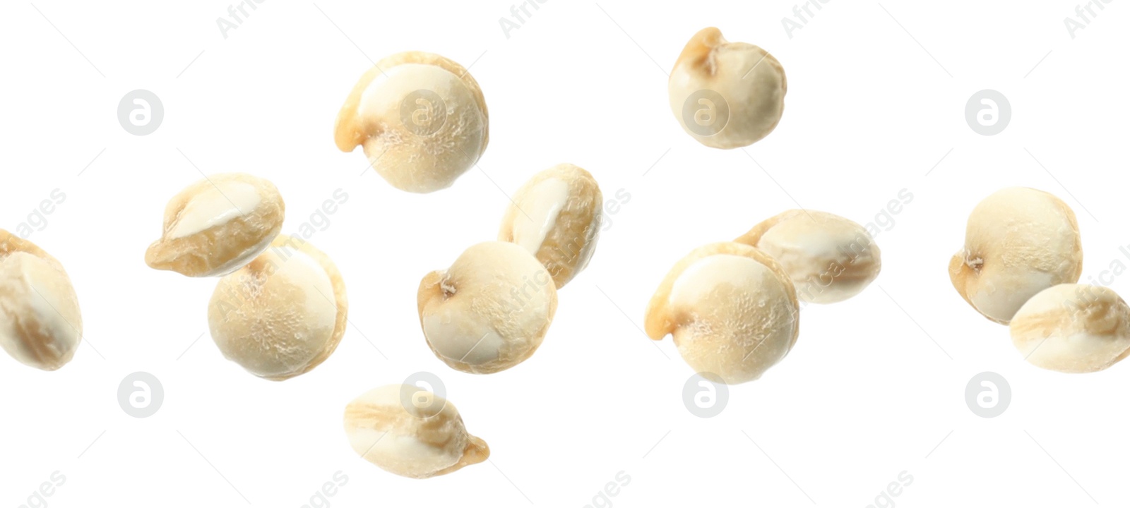 Image of Many quinoa seeds falling on white background, banner design. Vegan diet 