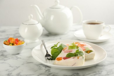 Delicious broken glass jelly dessert on white marble table