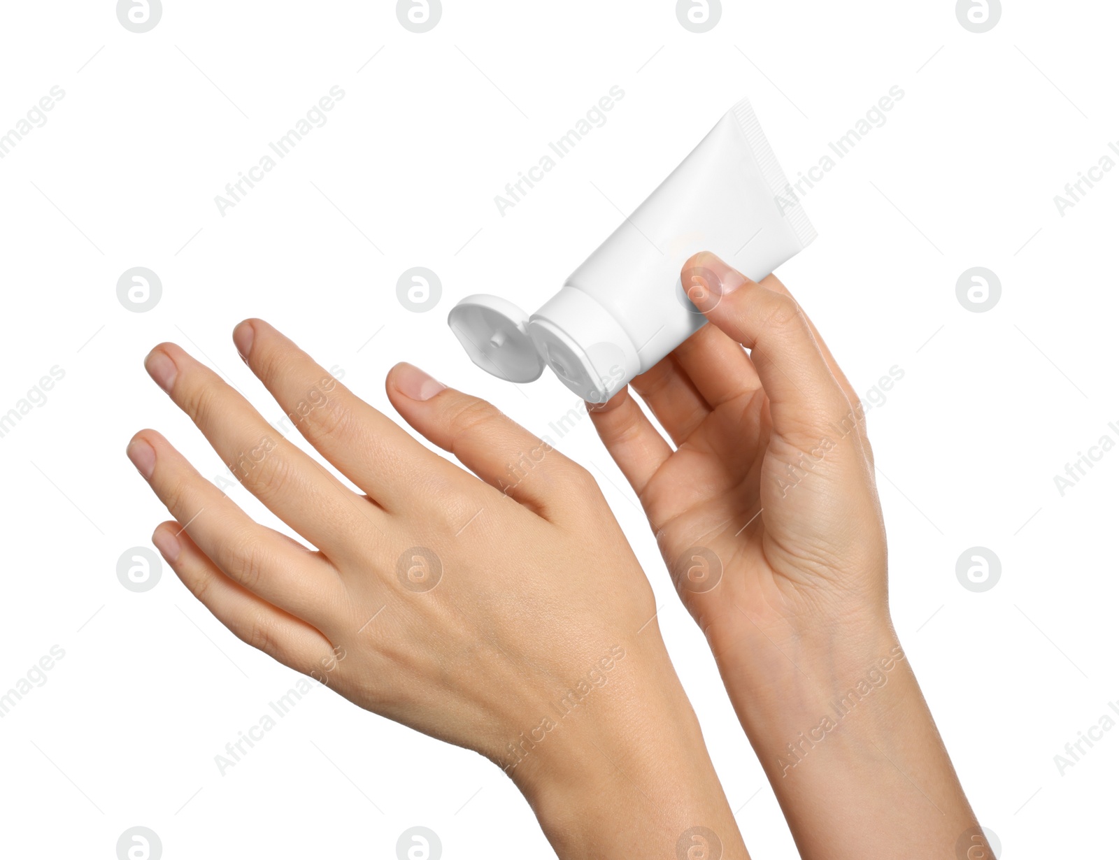 Photo of Woman applying cream on her hand against white background, closeup