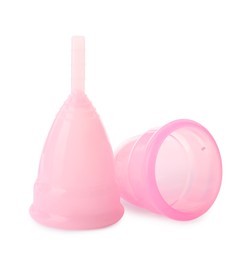 Two pink menstrual cups on white background
