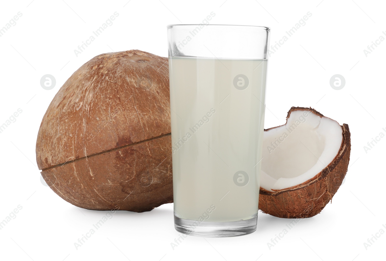 Photo of Glass of coconut water and nuts isolated on white