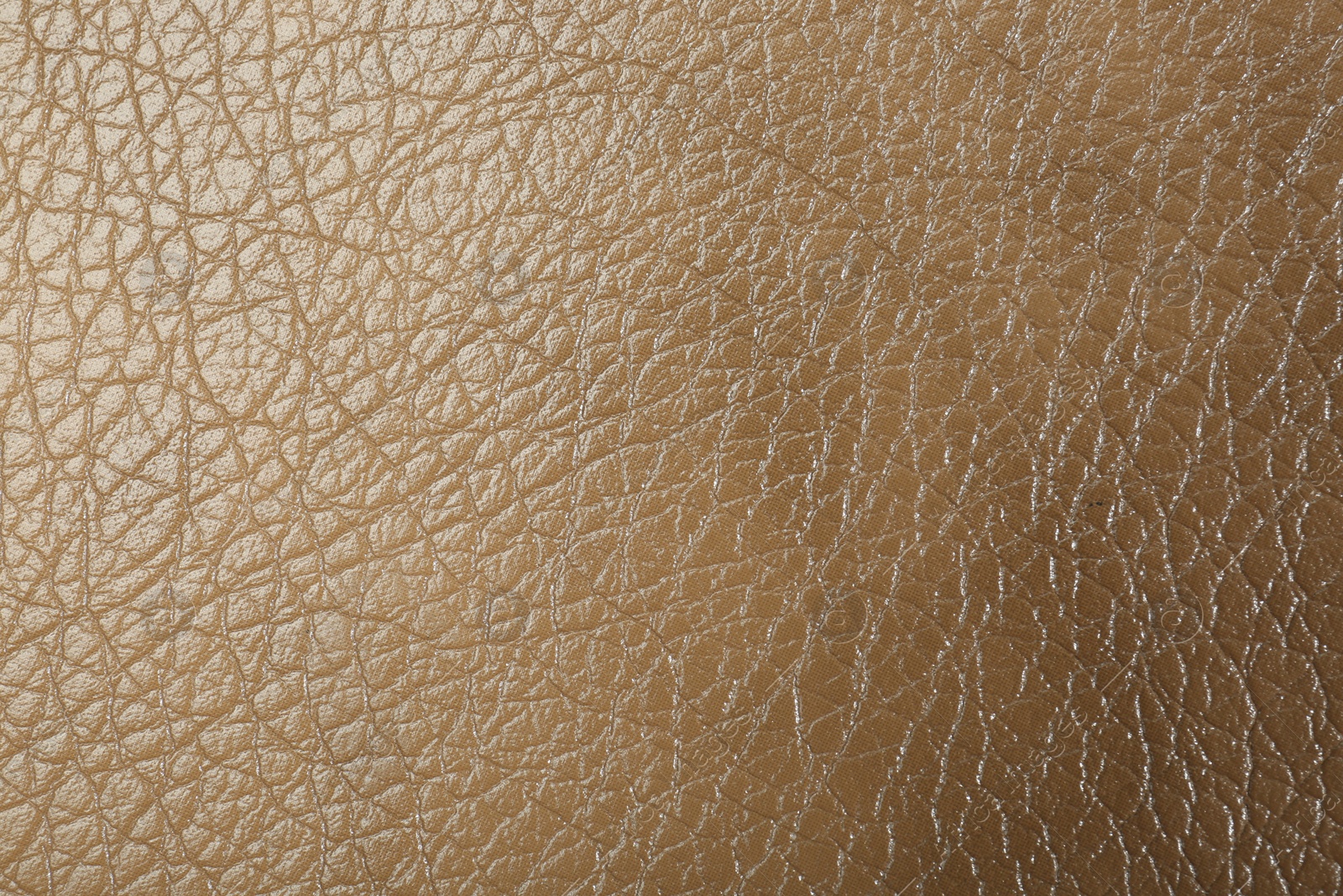 Photo of Texture of beige leather as background, top view