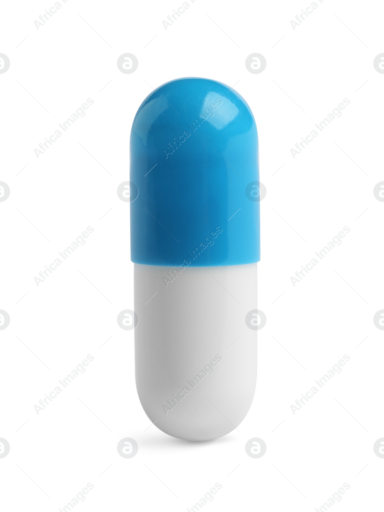 Photo of One pill on white background. Medicinal treatment