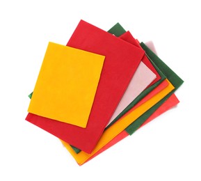Photo of Colorful reusable beeswax food wraps on white background, top view
